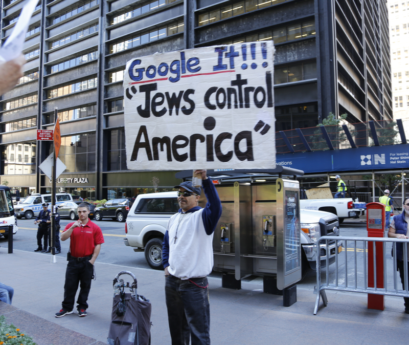 SEPTEMBER 17 2014 Occupy Wall Street protester with sign: Google It!!! Jews control America